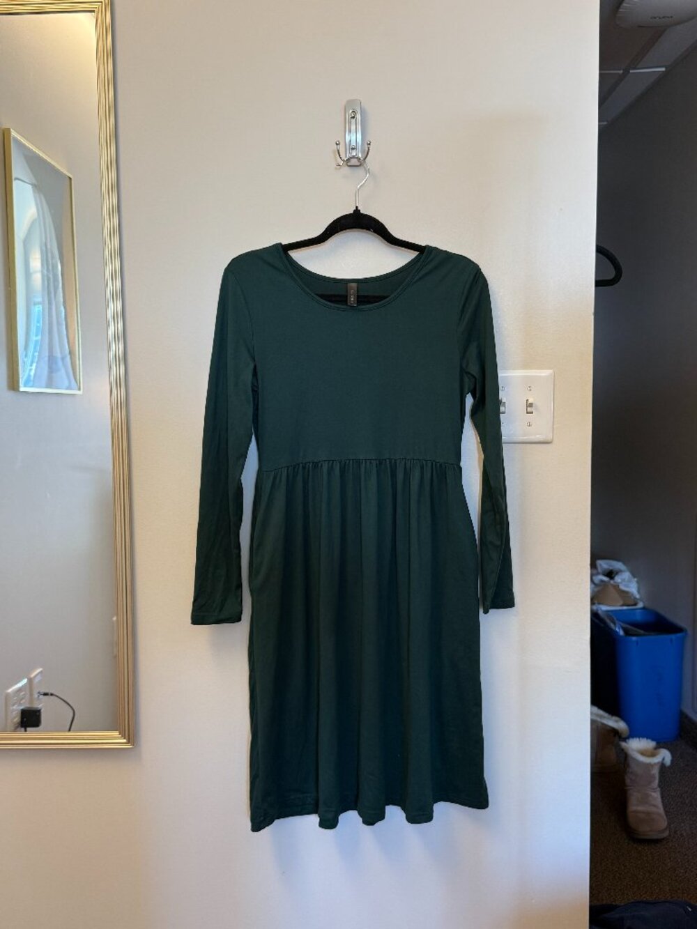 long sleeve dress with flowy bottom. Pocket on either side. Appropriate for casu